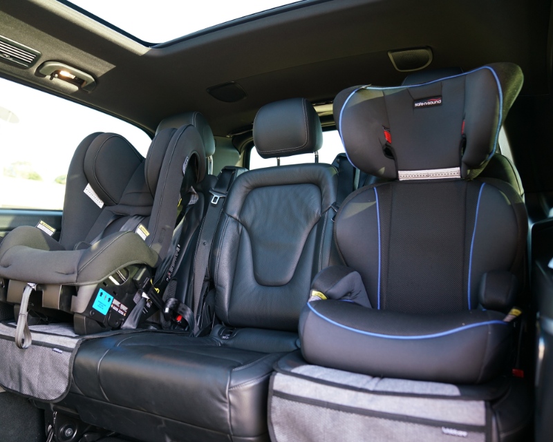 Premium child car seat installed safely inside van layout