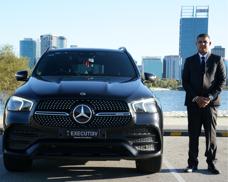 Professional Perth chauffeur with luxury vehicle